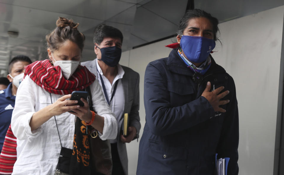 Presidential candidate Yaku Perez, of the Pachakutik party, arrives with his wife Manuela Picq, to the National Election Council to meet with his rival Guillermo Lasso, representing the Creating Opportunities party or CREO, to ask for a ballot recount of Sunday's election, in Quito, Ecuador, Friday, Feb. 12, 2021. It remains undecided which of the two has the votes to advance to the run-off race in April to face frontrunner Andres Arauz. (AP Photo/Dolores Ochoa)