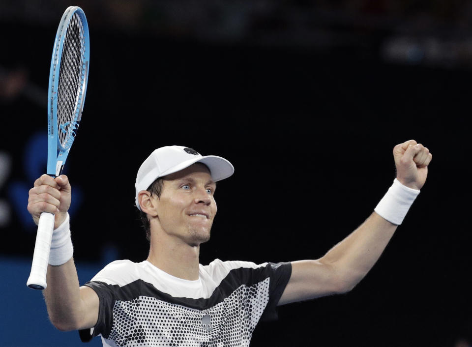 Tomas Berdych of the Czech Republic celebrates after defeating Argentina's Diego Schwartzman during their third round match at the Australian Open tennis championships in Melbourne, Australia, Friday, Jan. 18, 2019. (AP Photo/Aaron Favila)