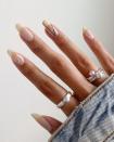 <p>You can <strong>apply a few coats of <a href="https://www.cosmopolitan.com/style-beauty/beauty/news/g5202/glitter-nail-polish-colors/" rel="nofollow noopener" target="_blank" data-ylk="slk:glitter nail polish;elm:context_link;itc:0;sec:content-canvas" class="link ">glitter nail polish</a> to give texture</strong> to a few of the nails, but for this minimal look, the thinner and simpler, the better.</p><p><a href="https://www.instagram.com/p/CDrkUVag73A/?utm_source=ig_embed&utm_campaign=loading" rel="nofollow noopener" target="_blank" data-ylk="slk:See the original post on Instagram;elm:context_link;itc:0;sec:content-canvas" class="link ">See the original post on Instagram</a></p>