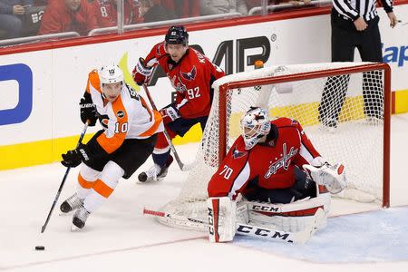 Apr 16, 2016; Washington, DC, USA; Washington Capitals goalie Braden Holtby (70) prepares to make a save on Philadelphia Flyers center Brayden Schenn (10) as Capitals center Evgeny Kuznetsov (92) defends in the third period in game two of the first round of the 2016 Stanley Cup Playoffs at Verizon Center. The Capitals won 4-1, and lead the series 2-0. Mandatory Credit: Geoff Burke-USA TODAY Sports