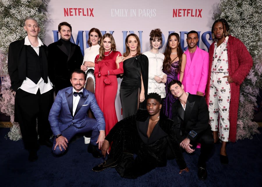 NEW YORK, NEW YORK - DECEMBER 15: (L-R) Bruno Gouery, Lucas Bravo, William Abadie, Kate Walsh, Camille Razat, Philippine Leroy-Beaulieu, Samuel Arnold, Lily Collins, Ashley Park, Paul Forman, Lucien Laviscount, and Jeremy O. Harris attend the Emily In Paris French Consulate Red Carpet at French Consulate on December 15, 2022 in New York City. (Photo by Jamie McCarthy/Getty Images for Netflix)