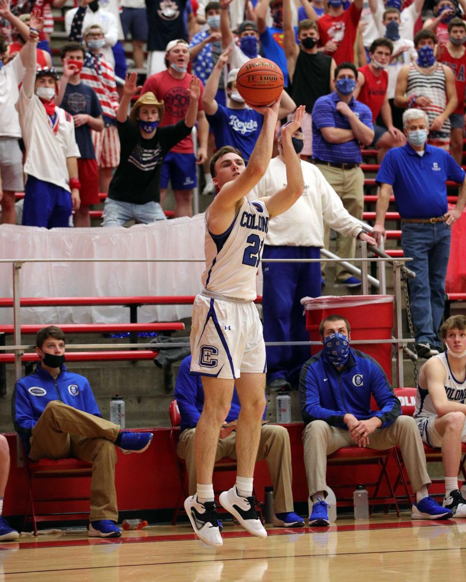 Cov Cath guard Walker Horn hits on this three-point shot in the game between Covington Catholic and St. Henry high schools at Holmes High School March 22, 2021.