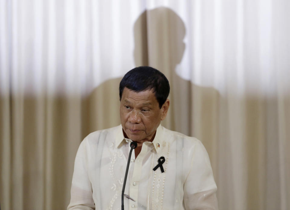 FILE - In this Tuesday, March 21, 2017 file photo, Philippine President Rodrigo Duterte speaks during a joint news conference with Thailand's Prime Minister Prayuth Chan-ocha, not pictured, at the government house in Bangkok. Filipino lawyer Jude Sabio has asked prosecutors of the International Criminal Court, ICC, to investigate his country's president for crimes against humanity for his alleged involvement in extrajudicial killings of suspected drug dealers and other crime suspects. (AP Photo/Sakchai Lalit, File)