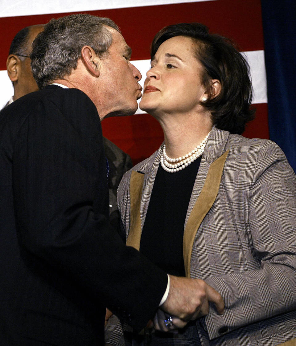 U.S. President George W. Bush kisses his sister Mrs. Doro Koch at a fundraiser at the Hyatt Regency Hotel on Dec. 5, 2003 in Baltimore, Maryland.  (PAUL J. RICHARDS/AFP/Getty Images)  -- Daughter of George H.W. Bush & Barbara Bush -- Sister of George W. Bush, Jeb Bush, Pauline Robinson Bush, Neil Bush, Marvin Bush