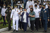 Amelita Ramos, front center, wife of former Philippine President Fidel Ramos, arrives during his state funeral at the Heroes' Cemetery in Taguig City, Philippines, Tuesday, Aug. 9, 2022. Ramos was laid to rest in a state funeral Tuesday, hailed as an ex-general, who backed then helped oust a dictatorship and became a defender of democracy and can-do reformist in his poverty-wracked Asian country. (Lisa Marie David/Pool Photo via AP)