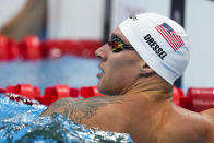 Caeleb Dressel, of the United States, reacts after winning a heat of the men's 100-meter butterfly at the 2020 Summer Olympics, Thursday, July 29, 2021, in Tokyo, Japan. (AP Photo/Charlie Riedel)