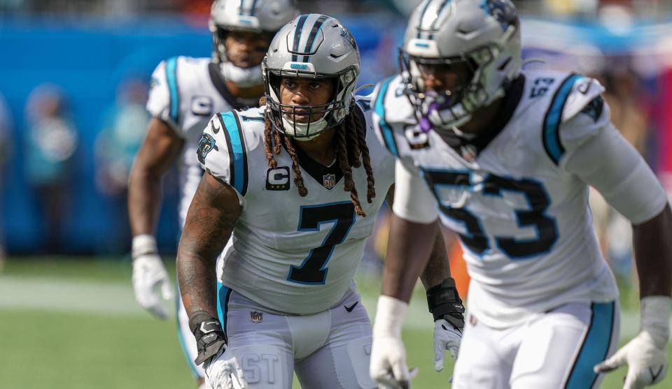 Carolina defensive end Brian Burns (53) and linebacker Shaq Thompson watch the Cleveland offense.