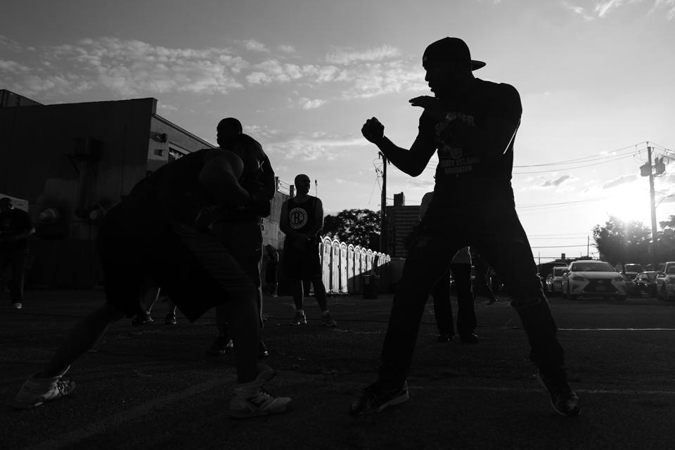 <p>A fighter works out with his trainer before the Brooklyn Smoker in the parking lot of Gargiulo’s Italian restaurant in Coney Island, Brooklyn, on Aug. 24, 2017. (Photo: Gordon Donovan/Yahoo News) </p>