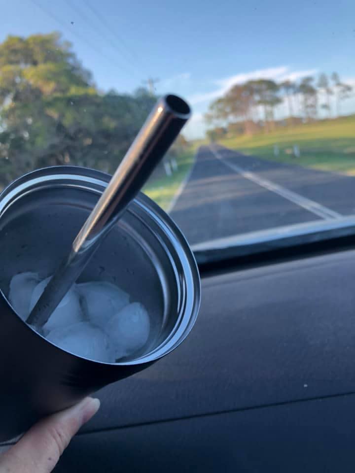 One user shared a photo of ice in her cup which had survived a four hour journey in a hot car during the Queensland summer. Photo: Facebook