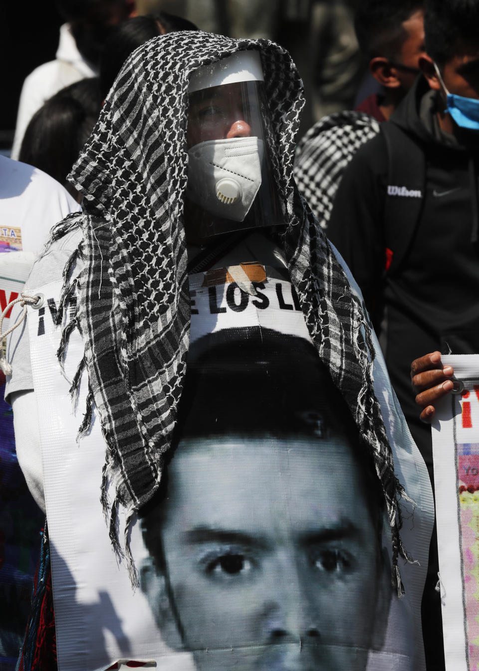 Relatives of the 43 missing students from the Rural Normal School of Ayotzinapa gather outside the Supreme Court during a protest to mark the upcoming sixth anniversary of the students’ disappearance, in Mexico City, Wednesday, Sept. 23, 2020. Family members continue to call for justice six years after the Ayotzinapa students were allegedly taken from buses by local police and turned over to a drug gang. (AP Photo/Marco Ugarte)