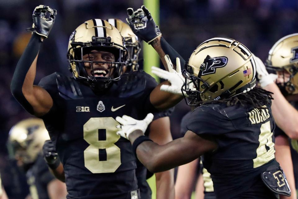 Purdue Boilermakers wide receiver TJ Sheffield (8) and Purdue Boilermakers wide receiver Deion Burks (4) react after a call is reversed during the NCAA football game against the Minnesota Golden Gophers, Saturday, Nov. 11, 2023, at Ross-Ade Stadium in West Lafayette, Ind. Purdue Boilermakers won 49-30.