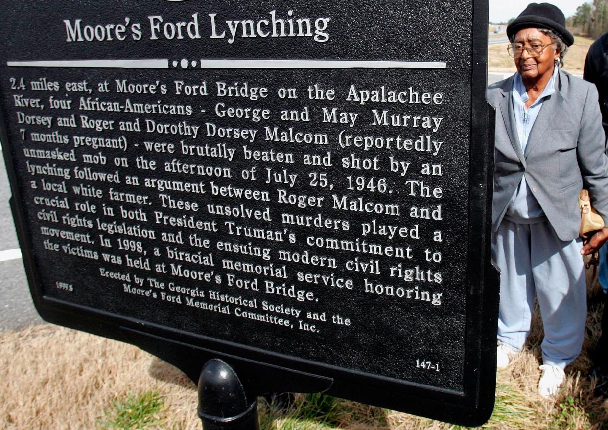 This Feb. 12, 2005, file photos shows Rosa Ingram, Roger Malcom's aunt, reading the Georgia Historical Society marker for the Moore's Ford bridge lynching, outside Monroe, Georgia. The brazen mass lynching horrified the nation that year but no one was ever indicted and investigations over the years failed to solve the case. (Photo: Ric Feld via AP)