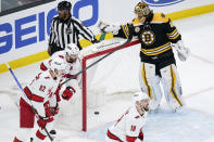 Boston Bruins goaltender Tuukka Rask (40) looks down towards the puck as he grabs his water bottle after a goal by Carolina Hurricanes center Derek Stepan during the first period of an NHL hockey game, Tuesday, Jan. 18, 2022, in Boston. Rask allowed five goals in the first period. (AP Photo/Charles Krupa)