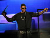 LOS ANGELES, CA - NOVEMBER 18: Singer Usher accepts the award for Favorite Soul/R&B Male Artist onstage during the 40th American Music Awards held at Nokia Theatre L.A. Live on November 18, 2012 in Los Angeles, California. (Photo by Kevin Winter/Getty Images)