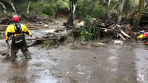 <p>Emergency personnel search through debris and mud flow after a mudslide in Montecito, Calif., Jan. 9, 2018. (Photo: Mike Eliason/Santa Barbara County Fire Department/Handout via Rreuters) </p>