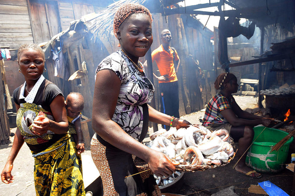 A girl carries smoked fish at Makoko shanty town in Lagos on Aug. 30, 2012. | PIUS UTOMI EKPEI—AFP/Getty Images