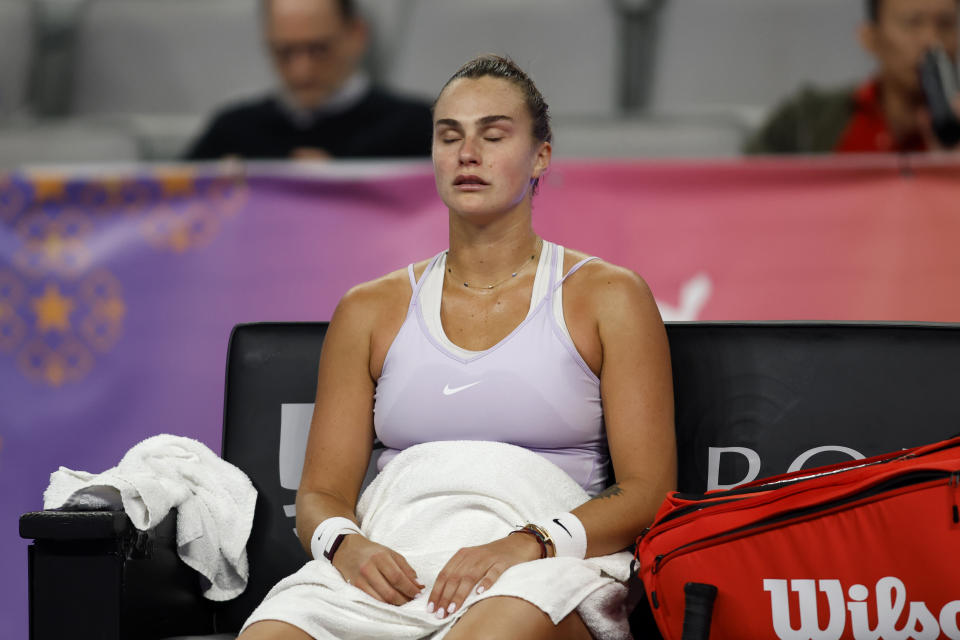 Aryna Sabalenka of Belarus closes her eyes during a change over in the second set of her match against Maria Sakkari of Greece during round-robin play on day three of the WTA Finals tennis tournament in Fort Worth, Texas, Wednesday, Nov. 2, 2022. Sakkari won 6-2, 6-4. (AP Photo/Tim Heitman)