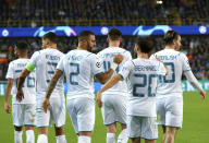 Manchester City's Kyle Walker, center left, is congratulated by Manchester City's Bernardo Silva, second right, after scoring his sides third goal during the Champions League Group A soccer match between Club Brugge and Manchester City at the Jan Breydel stadium in Bruges, Belgium, Tuesday, Oct. 19, 2021. (AP Photo/Olivier Matthys)