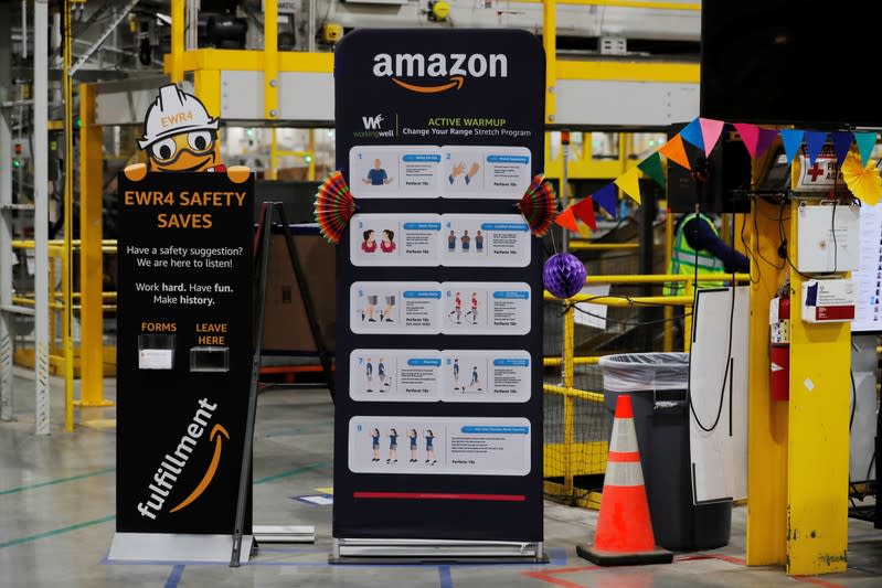 Exercise tips and safety instructions are displayed inside of an Amazon fulfillment center on Cyber Monday in Robbinsville, New Jersey