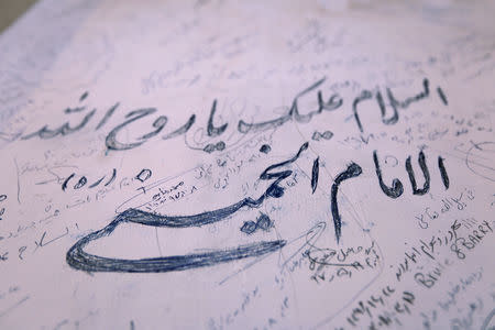 The memories of Iranian pilgrims writing on the wall reading "Peace be upon you Ruhollah Khomeini" is seen at the former home of the late Ayatollah Ruhollah Khomeini, in Najaf, Iraq February 9, 2019. Picture taken February 9, 2019. REUTERS/Alaa al-Marjani