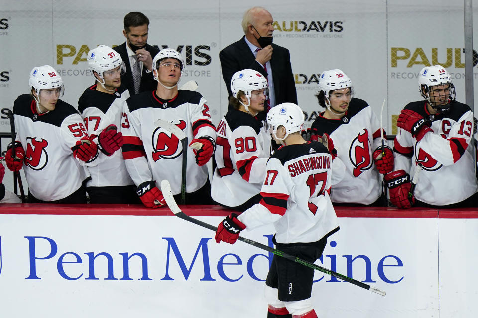 New Jersey Devils' Yegor Sharangovich (17) celebrates after scoring a goal during the third period of an NHL hockey game against the Philadelphia Flyers, Saturday, May 1, 2021, in Philadelphia. (AP Photo/Matt Slocum)