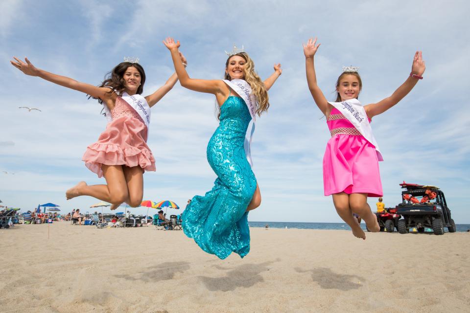 Junior Miss Hampton Beach Riley Harlow, Miss Hampton Beach 2022 Hannah Ritchie and Little Miss Hampton Beach Ella Kate Woods jump in celebration on the sand.