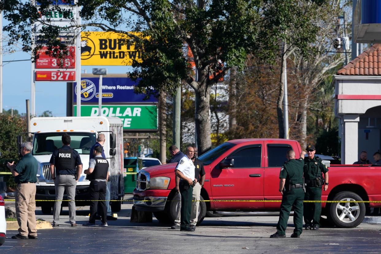 Crime scene tape surrounds a pickup at a Sunoco station on West International Speedway Boulevard on Thursday, Dec. 1, 2022 where a Daytona Beach police officer shot and killed an attacker.