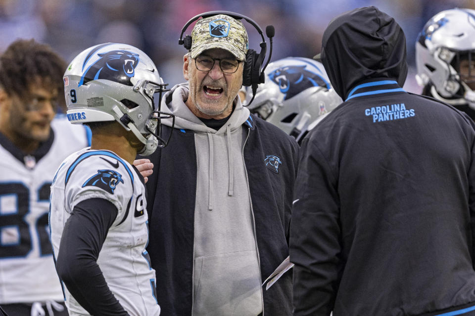 FILE - Carolina Panthers quarterback Bryce Young (9) listens as head coach Frank Reich gives him instruction during their NFL football game against the Tennessee Titans Sunday, Nov. 26, 2023, in Nashville, Tenn. The Carolina Panthers fired coach Frank Reich on Monday, Nov. 27, with the team off to an NFL-worst 1-10 record in his first year in charge.(AP Photo/Wade Payne, File)