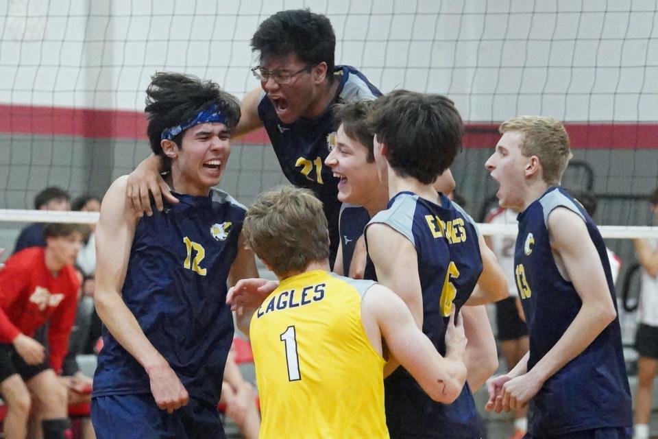 The Barrington boys volleyball team celebrates after winning the final point in Thursday's five-set win over Cranston West that puts the Eagles on the fast track to earning the No. 1 seed for the upcoming Division II playoffs.