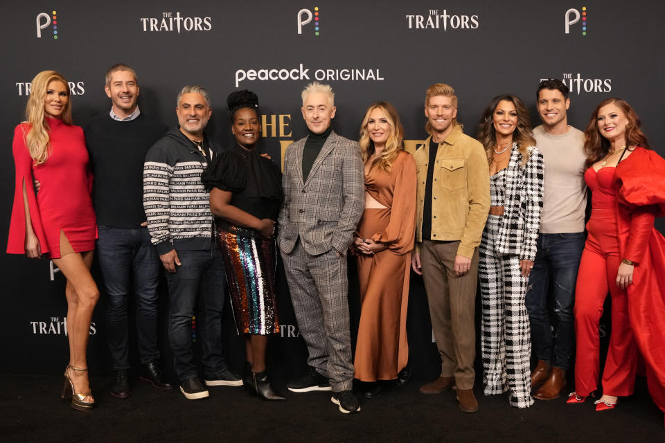 THE TRAITORS -- The Traitors Photo Call -- Pictured: (l-r) Brandi Glanville, Arie Luyendyk Jr., Reza Farahan, Cirie Fields, Alan Cumming, Kate Chastain, Kyle Cooke, Stephenie LaGrossa Kendrick, Cody Calafiore, Rachel Reilly at the Peacock Lounge on December 14, 2022 -- (Photo by: Virginia Sherwood/Peacock via Getty Images)