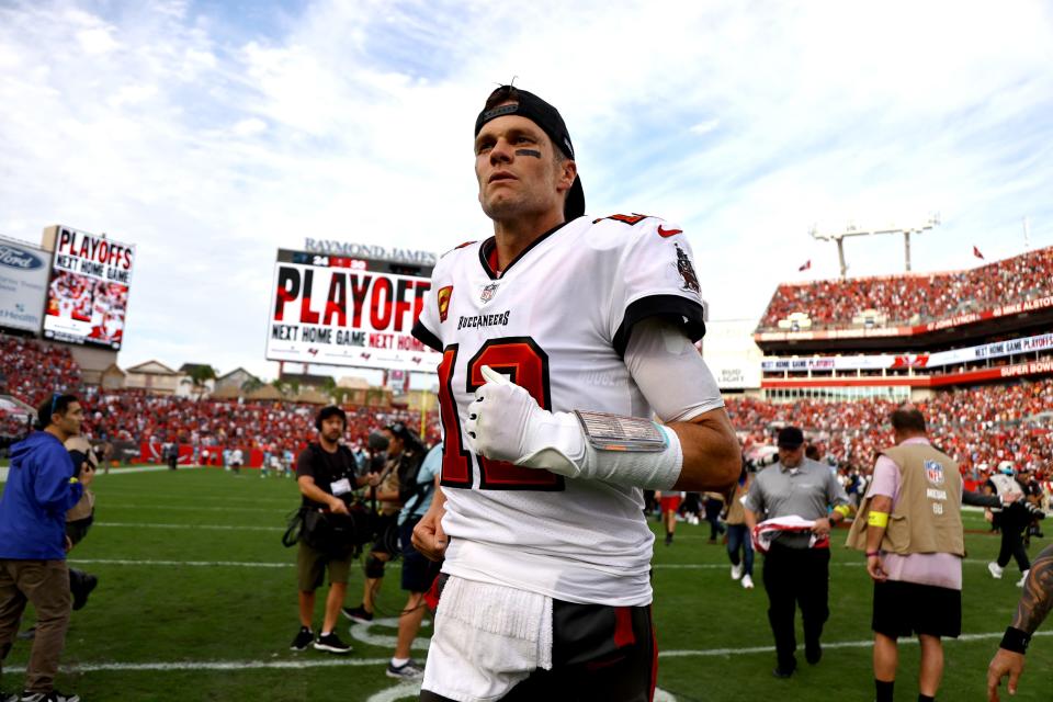 Tom Brady runs off the field after the Tampa Bay Buccaneers beat the Carolina Panthers in January.