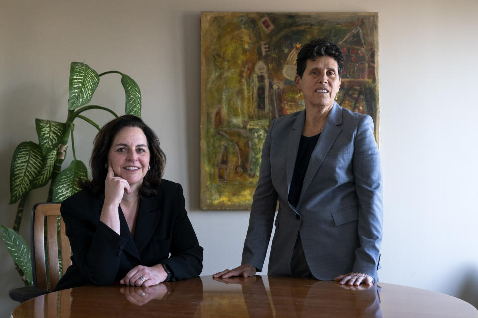 In this May 21, 2021, photo Washington based civil rights attorneys Lisa Banks, left, and Debra Katz, pose for a portrait at their law firm in Washington. For many people, the pandemic year has brought a pause of some kind, or at least a slowdown, to their professional endeavors. For Katz and Banks, the opposite has been true. “This is probably the biggest year we’ve ever had,” says Banks. Their work has been increasing for nearly four years. When the Harvey Weinstein revelations erupted in October 2017, launching the reckoning that became known as the #MeToo movement, it caused “a sea change," Katz says. (AP Photo/Jacquelyn Martin)