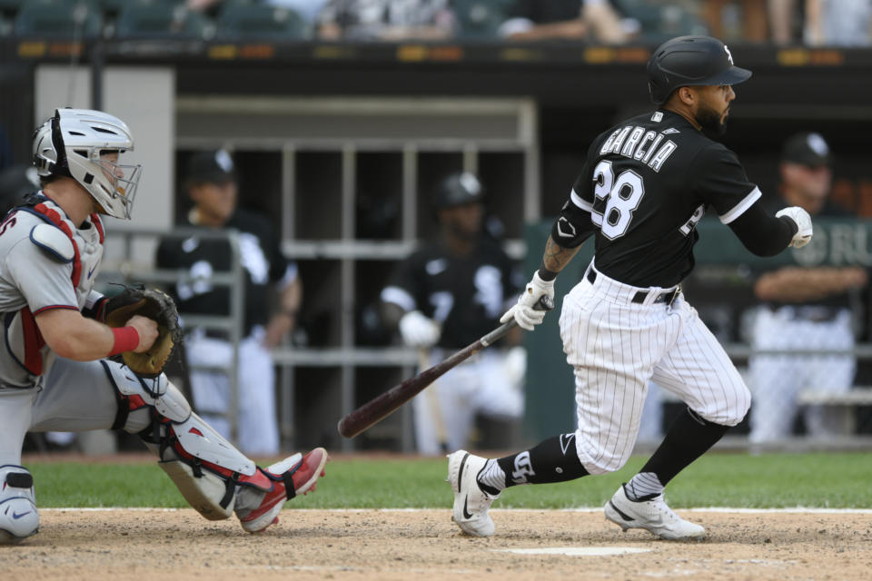 Chicago White Sox's Leury Garcia watches his single against the Minnesota Twins that drove in the winning run in the 10th inning of a baseball game Wednesday, July 6, 2022, in Chicago. (AP Photo/Paul Beaty)