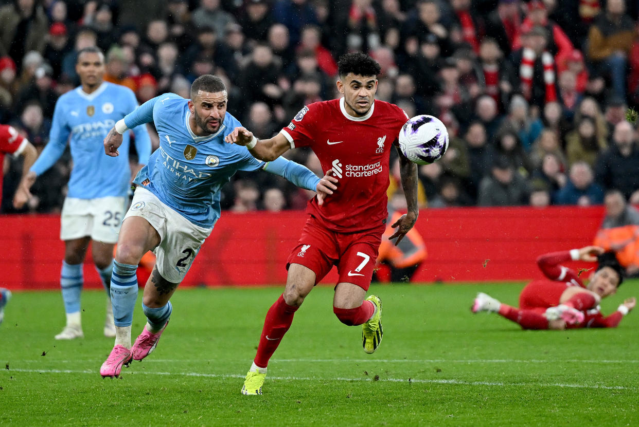 Liverpool's Luis Diaz (centre) and Manchester City's Kyle Walker tussle for the ball during their English Premier League clash at Anfield. 