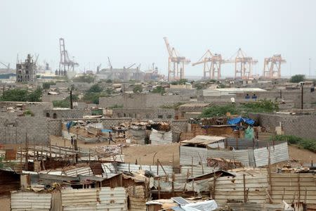 Hodeidah port's cranes are pictured from a nearby shantytown in Hodeidah, Yemen June 16, 2018. REUTERS/Abduljabbar Zeyad