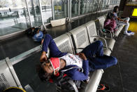 Stranded passengers sleep outside an airport during lockdown in Kolkata, India, Friday, Sept. 11, 2020. By early May, 6.4 million people in India were likely infected by the coronavirus, said a study released Thursday, Sept. 10, by Indian scientists from the Indian Council of Medical Research, India’s apex medical research body and published in their in-house medical journal. At the time, India had detected around 35,000 cases and over a thousand deaths. But the results of India’s first nationwide study of prevailing infections in the country found that for every confirmed case that detected in May, authorities were missing between 82 and 130 infections. The study tested 28,000 people for proteins produced in response to the virus in the villages and towns across 70 districts in 21 Indian states between May 11 to June 14. (AP Photo/Bikas Das)