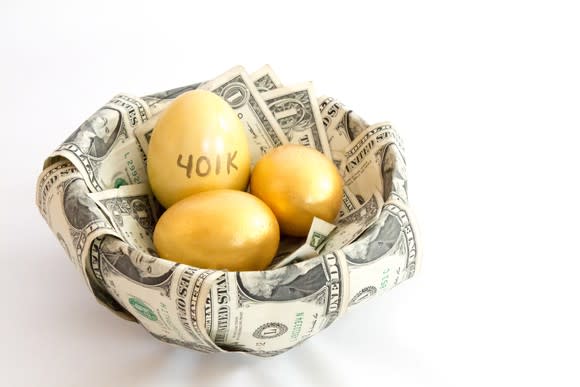 Three golden eggs in a basket of dollar bills, with 401K written on one of the eggs.