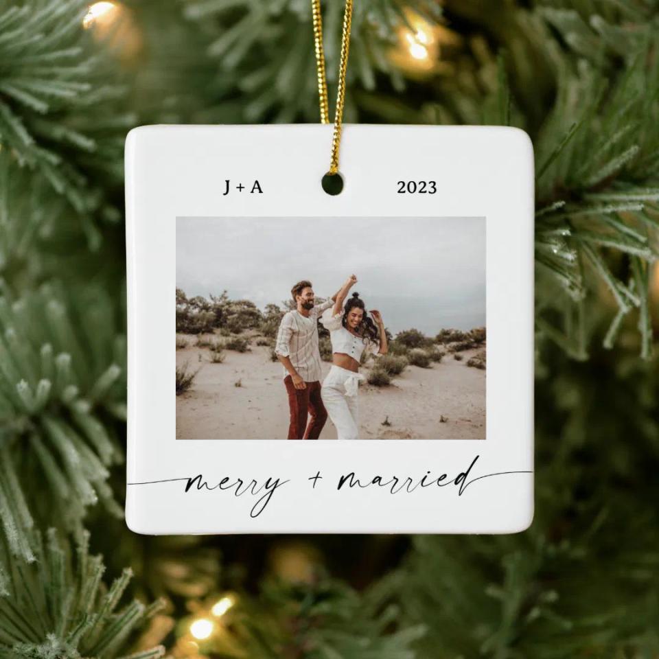 <p><a href="https://go.redirectingat.com?id=74968X1596630&url=https%3A%2F%2Fwww.zazzle.com%2Fminimalist_photo_ornament_merry_married_photo-175412533875631181&sref=https%3A%2F%2Fwww.oprahdaily.com%2Flife%2Frelationships-love%2Fg31879185%2Fwedding-gift-ideas%2F" rel="nofollow noopener" target="_blank" data-ylk="slk:Shop Now;elm:context_link;itc:0;sec:content-canvas" class="link ">Shop Now</a></p><p>Merry & Married Photo Ornament</p><p>zazzle.com</p><p>$16.04</p><span class="copyright">Zazzle</span>