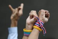 A group of royalists protest in front of parliament as they counter protest pro-democracy demonstrators and show support to the monarchy in Bangkok