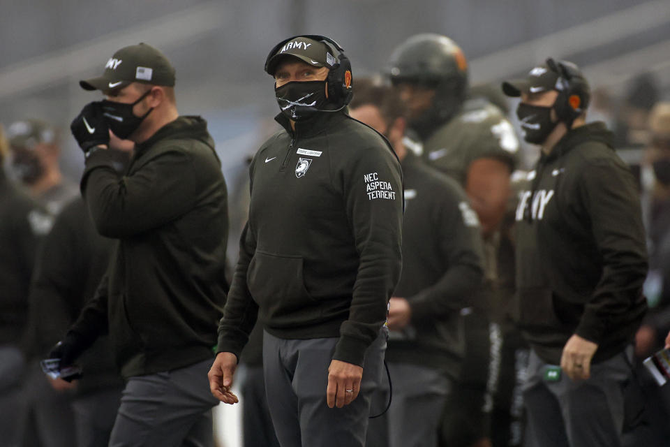 FILE - In this Saturday, Dec. 12, 2020, file photo, Army head coach Jeff Monken looks on against Navy during the first half of an NCAA college football game in West Point, N.Y., in the 121st playing of the Army-Navy game. Army has a 9-2 record and was planning to play in the Independence Bowl. When that bowl game was called off because there was not another team available, it suddenly left Army looking for a postseason opponent. The Black Knights could be in line should some bowl-bound team find itself dealing with COVID-19 issues. (AP Photo/Adam Hunger, File)