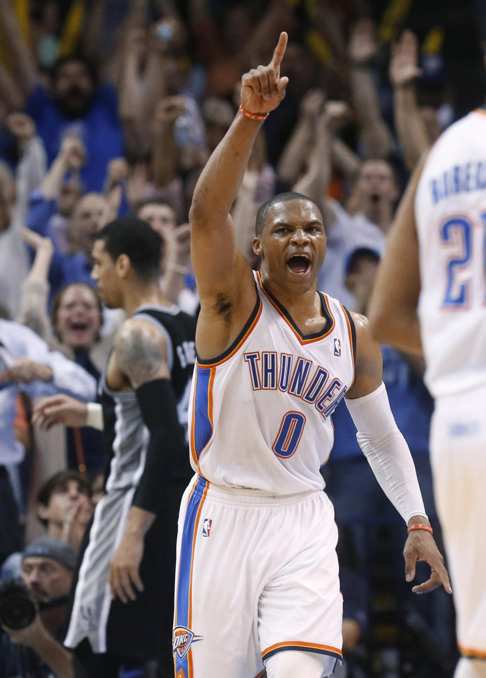 Oklahoma City Thunder guard Russell Westbrook celebrates after a basket against the San Antonio Spurs during the third quarter of an NBA basketball game in Oklahoma City, Thursday, April 3, 2014. Oklahoma City won 106-94. (AP Photo/Sue Ogrocki)