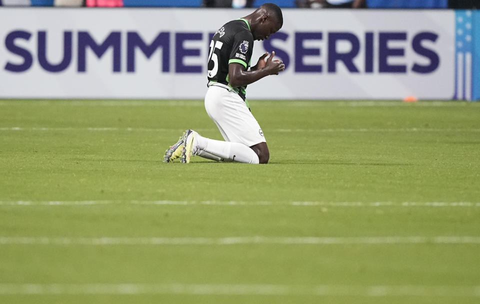 Brighton's Moisés Caicedo (25) kneels after the team's Premier League Summer Series soccer match against Brentford, Wednesday, July 26, 2023, in Atlanta. (AP Photo/Brynn Anderson)
