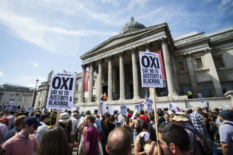 Demonstrators hold 'Oxi' placards in Trafalgar Square in central London at a rally supporting a 'No' vote in Greece's referendum