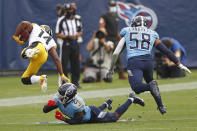 Pittsburgh Steelers wide receiver Ray-Ray McCloud (14) flies through the air after being hit by Tennessee Titans cornerback Malcolm Butler (21) in the second half of an NFL football game Sunday, Oct. 25, 2020, in Nashville, Tenn. (AP Photo/Wade Payne)