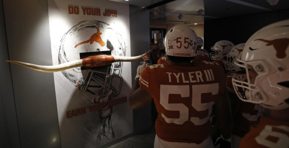 Members of the Texas Longhorns touch the longhorns before the game against LSU Tigers Saturday Sept. 7, 2019 at Darrell K Royal-Texas Memorial Stadium in Austin, Tx. ( Photo by Edward A. Ornelas )