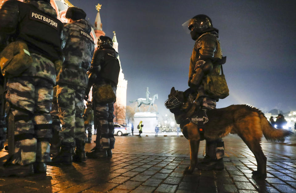 Servicemen of the Russian National Guard (Rosgvardia) gather at the Red Square to prevent a protest rally in Moscow, Russia, Tuesday, Feb. 2, 2021. A Moscow court has ordered Russian opposition leader Alexei Navalny to prison for more than 2 1/2 years on charges that he violated the terms of his probation while he was recuperating in Germany from nerve-agent poisoning. Navalny, who is the most prominent critic of President Vladimir Putin, had earlier denounced the proceedings as a vain attempt by the Kremlin to scare millions of Russians into submission. (AP Photo/Pavel Golovkin)