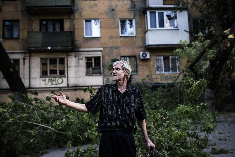 А man reacts after shelling in Donetsk on August 20, 2014