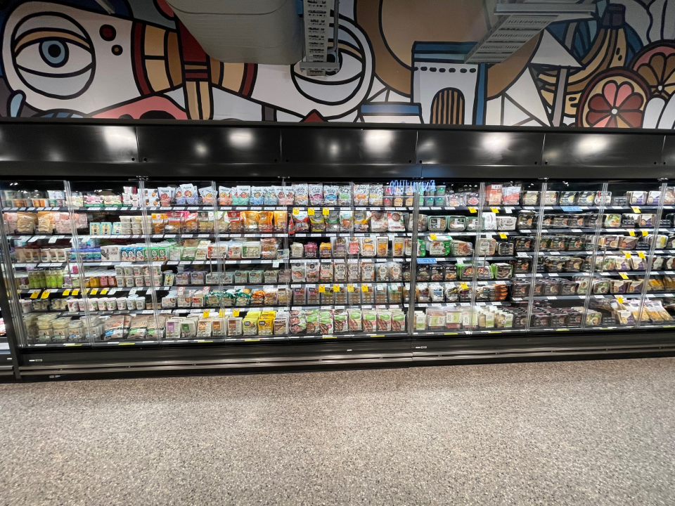 Colourful mural above fridge section in store. Source: Coles, provided