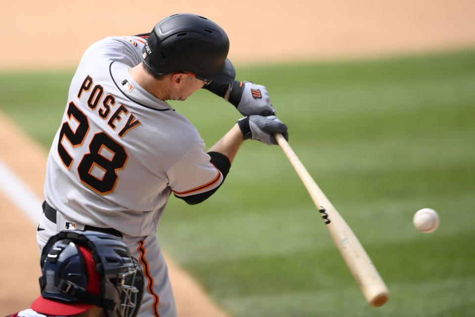 San Francisco Giants' Buster Posey bats during the sixth inning of the first baseball game of a doubleheader against the Washington Nationals, Saturday, June 12, 2021, in Washington. This game is a makeup of a postponed game from Thursday. The Nationals won 2-0. (AP Photo/Nick Wass)