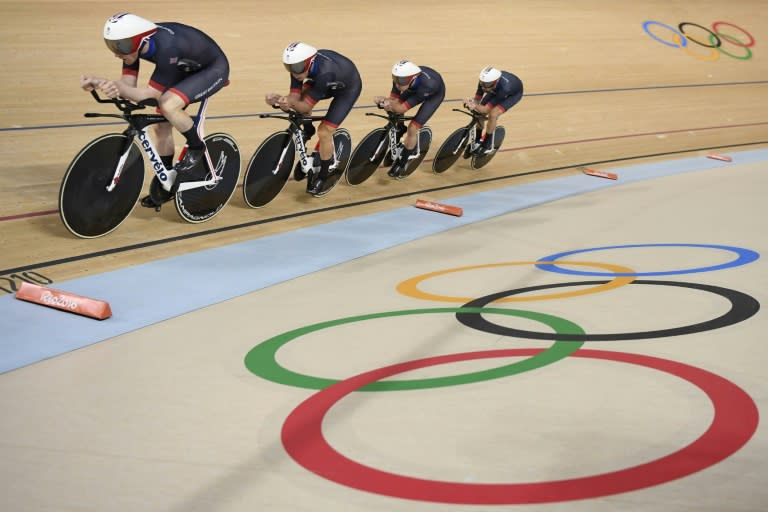 (From L) Britain's Edward Clancy, Steven Burke, Owain Doull and Bradley Wiggins compete in the men's team pursuit qualifying track cycling event on August 12, 2016